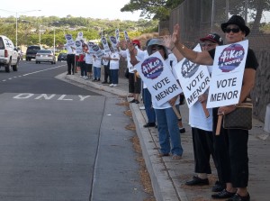 Dozens of AiKea supporters wave signs in support for Ron Menor for Honolulu City Council